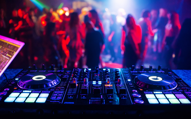A DJ playing at a party.
